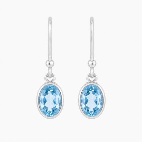Zilveren oorhangers met ovaal in kap gezette edelsteen - 925 zilver - 22 x 6 mm · Blauwe Topaas