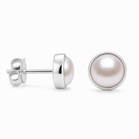 Zilveren oorknopjes met rond in kap gezette edelsteen - 925 zilver - 4 mm · Parel