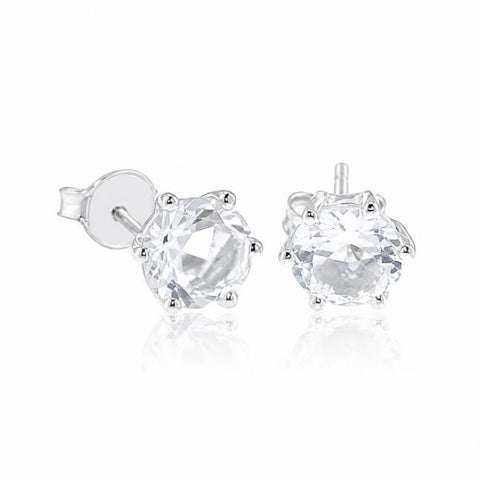 Zilveren oorknopjes met rond gefacetteerde chaton gezette edelstenen - 925 zilver - 7 mm · Bergkristal
